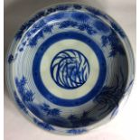 A 19TH CENTURY JAPANESE ARITA PORCELAIN BOWL Hand painted with infer glaze blue chrysanthemum and