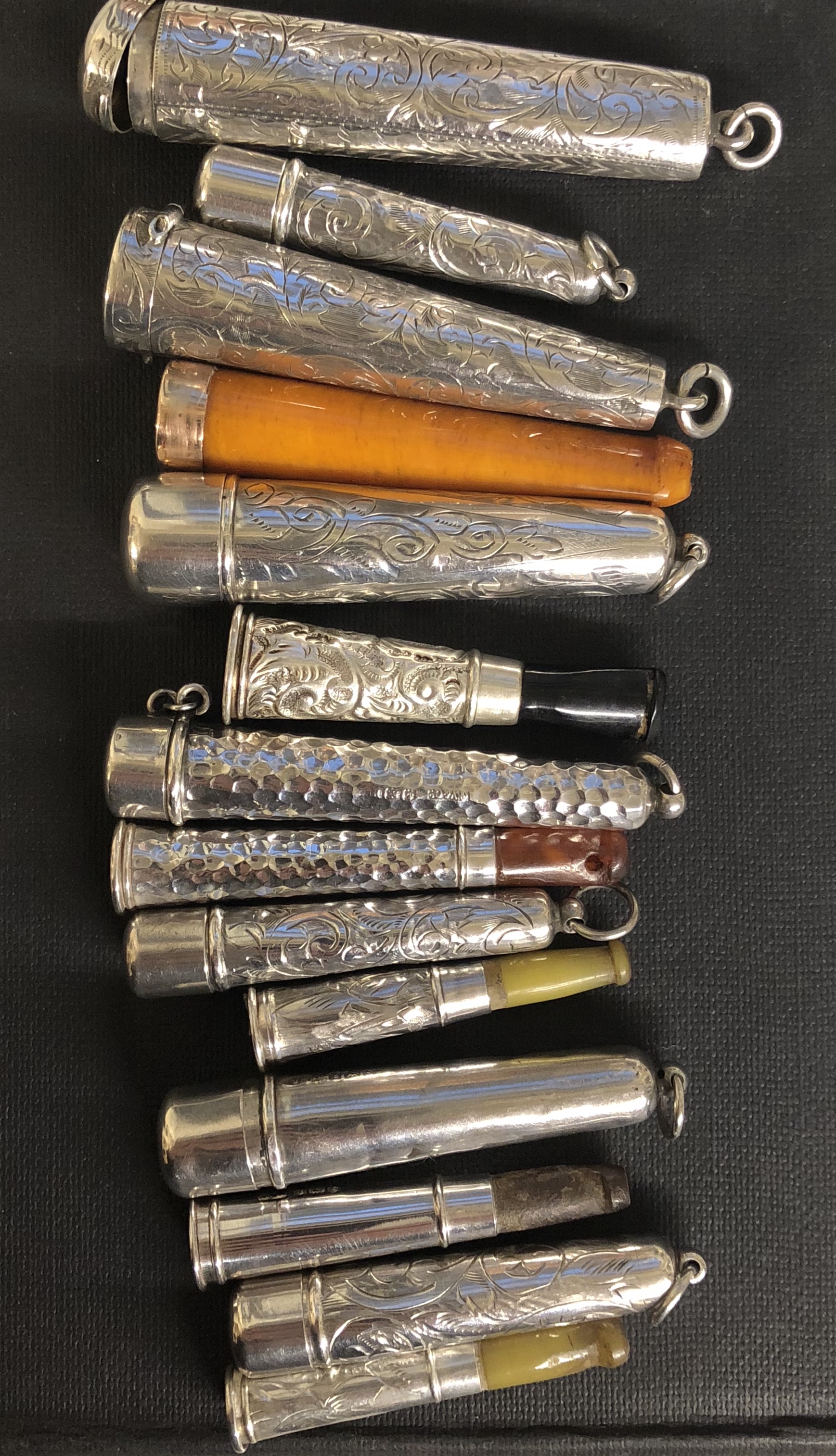 A COLLECTION OF EIGHT HALLMARKED SILVER CHEROOT CASES Six with cheroots. (largest 7cm)