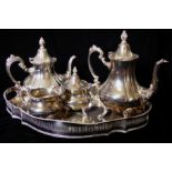 A 20TH CENTURY SILVER PLATED FOUR PIECE TEA SERVICE Comprising a teapot, coffee pot, covered sugar