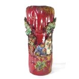 A JAPANESE SUMIDA GAWA POTTERY SLEEVE VASE The red glaze body having applied figures and trees. (