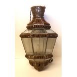 AN OCTAGONAL FORM HANGING LANTERN With panelled glass and pierced motif. (h 50cm)