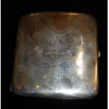 AN EDWARDIAN SILVER CIGARETTE CASE Of plain form, bearing an engraved family crest of a hand with