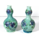 WILLIAM MOORCROFT FOR LIBERTY & CO., A PAIR OF DOUBLE GOURD VASES Tudor Rose pattern, registration