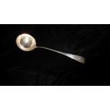 AN EARLY 20TH CENTURY SILVER SOUP LADLE Of plain form with engraved initial, hallmarked London,