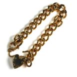 A VINTAGE 9CT GOLD BRACELET The curb link with heart form clasp. (approx 16cm)