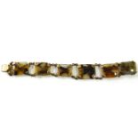 A VICTORIAN GILT METAL AND AGATE BRACELET Six rectangular agate panels held with shell form gilt