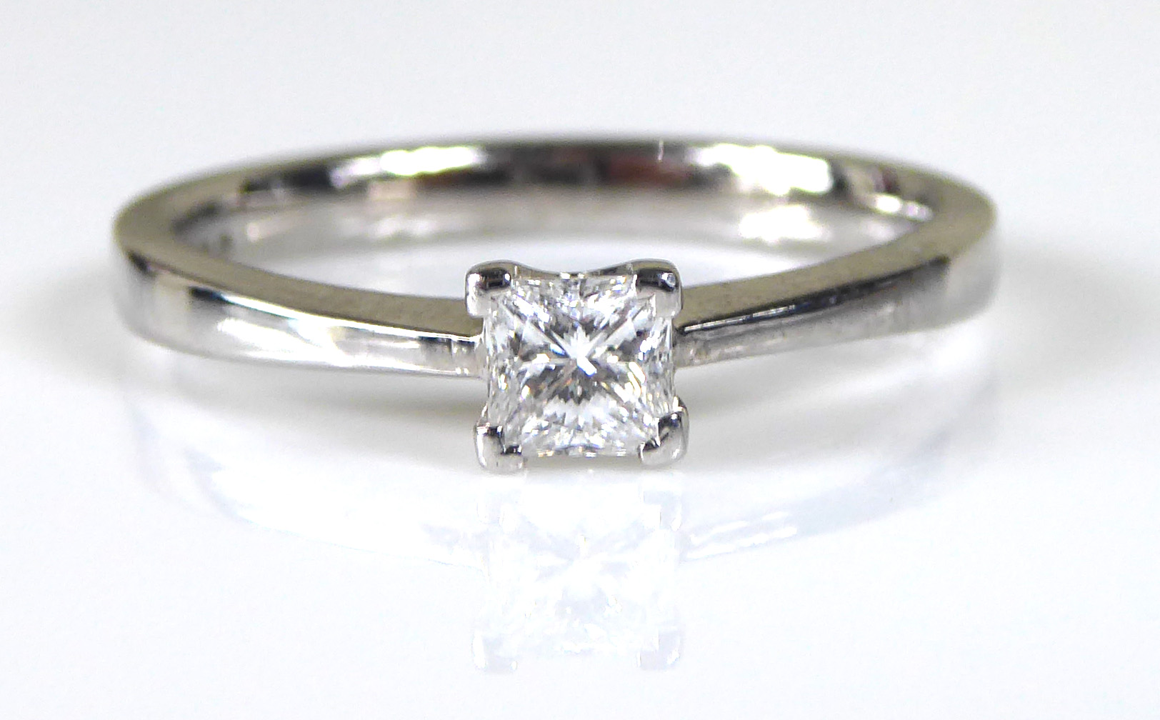 AN 18CT WHITE GOLD AND DIAMOND SOLITAIRE RING Set with a Princess cut stone held in a raised - Image 2 of 2