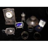 A SELECTION OF ANTIQUE AND LATER SILVER ITEMS Comprising of a 1920's inkwell, three napkin rings,