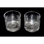 A PAIR OF 19TH CENTURY FIRING GLASSES Of shallow tumbler form and both engraved at one side with