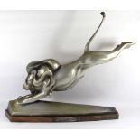 COLKA, A 20TH CENTURY CONTINENTAL SILVERED BRONZE FIGURE OF A PRANCING LION Mounted on front paws on