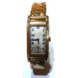 AN ART DECO 14CT GOLD FILLED CURVEX GENT'S WRISTWATCH The rectangular form with Arabic number