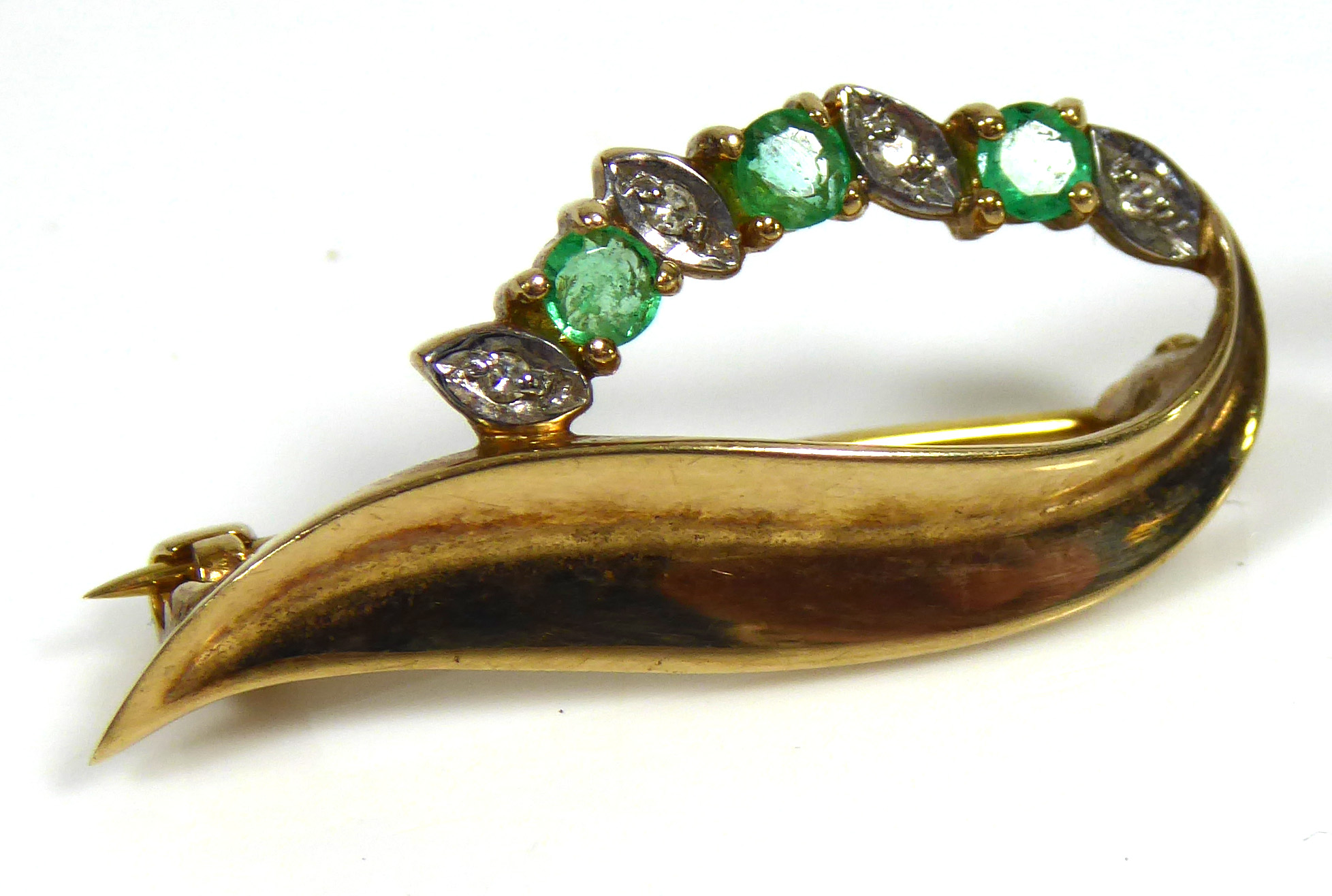 A VINTAGE 9CT GOLD, DIAMOND AND EMERALD BROOCH Set with three round cut emeralds interspersed with - Image 2 of 2