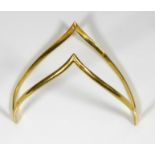 A VINTAGE HIGH CARAT GOLD SLAVE BANGLE Wishbone form of plain design. (approx 7cm)