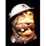 A WORLD WAR I WILKINSONS POTTERY 'OLD BILL' COMMEMORATIVE CHARACTER JUG Soldier wearing a tin hat,