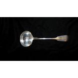 A VICTORIAN SILVER LADLE Fiddle pattern, with engraved family crest of a hand with sword, hallmarked