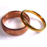 A VINTAGE 22CT GOLD WEDDING BAND Of plain form, together with a 9ct rose gold wide wedding band (