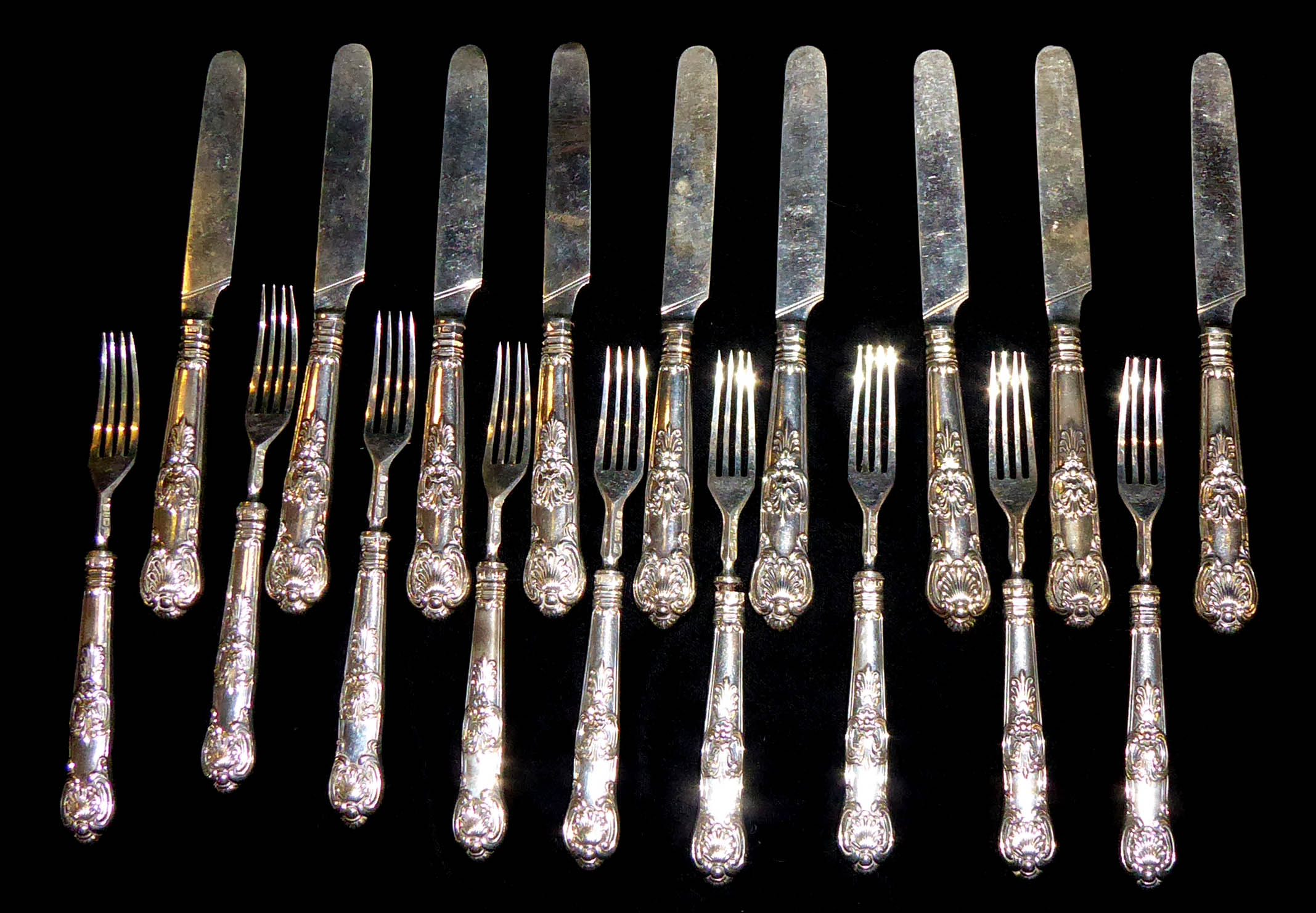 AARON HADFIELD, A SET OF NINE WILLIAM VI SILVER FRUIT KNIVES AND FORKS Kings pattern handles with