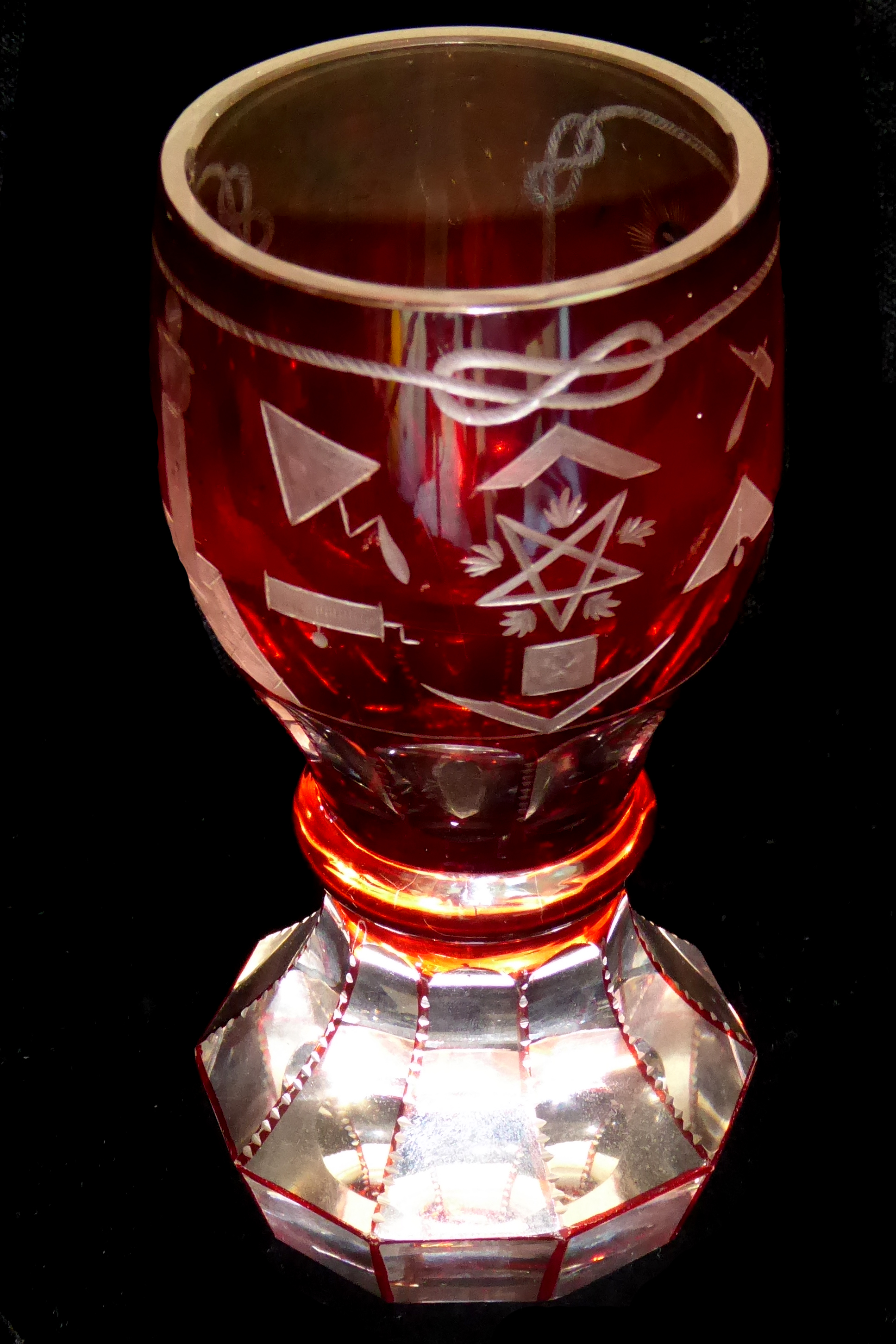 A LATE 19TH CENTURY BOHEMIAN FIRING GLASS With heavy panel form base and bulbous bowl above a single