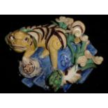 AN CHINESE YELLOW GLAZE POTTERY WALL POCKET Modelled with two stylized dragons with a censor on blue