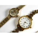 ROTARY, A VINTAGE 9CT GOLD LADIES' WRISTWATCH The silver tone circular dial with 9ct gold bracelet
