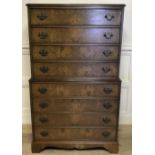 A VINTAGE WALNUT CHEST ON CHEST With an arrangement of four short drawers over four long drawers,