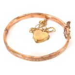 A VINTAGE 9CT GOLD OVAL BANGLE With engraved decoration, together with a 9ct gold heart form