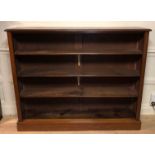 A LARGE 19TH CENTURY MAHOGANY OPEN BOOKCASE Having an arrangement of three adjustable shelves, on