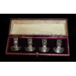 SAMPSON MORDAN AND CO., A CASED SET OF FOUR EDWARDIAN NOVELTY SILVER OWL PLACE CARD HOLDERS Having