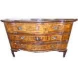 AN 18TH CENTURY WALNUT SERPENTINE THREE DRAWER COMMODE Fitted with brass escutcheons and handles,