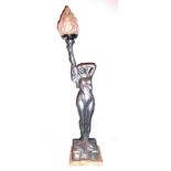 AN ART NOUVEAU DESIGN PEWTER TABLE LAMP Modelled as a semi-clad female holding a tour has. (h 94cm)