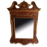 A GEORGE I DESIGN BURR WALNUT EFFECT AND PARCEL GILT FRAMED MIRROR. (61cm x 86cm)