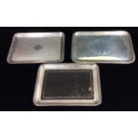 A COLLECTION OF THREE EARLY 20TH CENTURY RECTANGULAR TRINKET TRAYS One set with a tortoiseshell