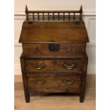 AN 18TH CENTURY LATER OAK BIBLE BOX ON PINE CHEST Of two drawers, the rising hinged lid opening to