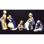 ROYAL COPENHAGEN, A COLLECTION OF FOUR DANISH PORCELAIN FIGURINES A young girl with a dog, model