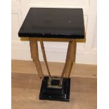 AN ART DECO DESIGN CHROME AND EBONIZED WOOD PEDESTAL STAND The square top on geometric supports,