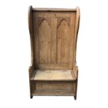 A VICTORIAN STYLE RECLAIMED PINE HALL SETTLE In the Gothic style, with rise and fall seat. (85cm x