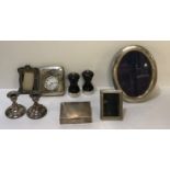 A COLLECTION HALLMARKED SILVER ITEMS To include cased travel watch, a pair of squat candlesticks,