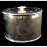 A GEORGIAN SILVER OVAL TEA CADDY BOX With bright cut engraving, bearing a family crest with the