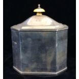 AN EDWARDIAN SILVER OCTAGONAL TEA CADDY With Ivory finial, opening to reveal two compartments