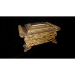 A RARE AND UNUSUAL REGENCY PERIOD CREAM LEATHER SEWING CASKET Of sarcophagus form with brass