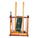 JAQUES OF LONDON, A 20TH CENTURY CROQUET SET Comprising four mallets, three balls and six hoops,