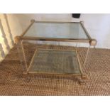 A HEAVY BRASS AND GLASS DESIGNER TWO TIER OCCASIONAL TABLE. (w 60cm x h 50cm x d 50cm)