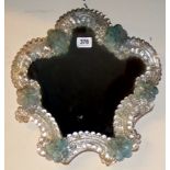 A DECORATIVE 20TH CENTURY CARTOUCHE SHAPE VENETIAN GLASS MIRROR With blue flowerheads. (35cm x