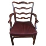 A CHIPPENDALE DESIGN MAHOGANY LADDER BACK OPEN ARMCHAIR With carved rail and scrolling arms,