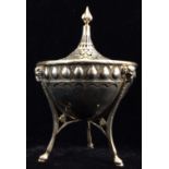 AN EDWARDIAN SILVER BOWL AND COVER Having a pierced lid with an embossed band of egg form motifs,