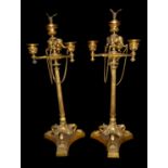 A FINE PAIR OF 19TH CENTURY FRENCH GILT BRONZE CANDELABRA Having bird finials, elephant masks and