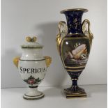 A 19TH CENTURY FRENCH VASE The handles in the form of swans, the panels decorated with a still