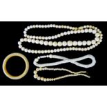 A COLLECTION OF VICTORIAN IVORY JEWELLERY To include a large graduated spherical bead neckace,