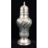 A LARGE EDWARDIAN SILVER SUGAR SIFTER Having a prided dome lid and fluted decoration, initialled '
