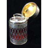 AN EDWARDIAN SILVER AND RUBY GLASS CYLINDRICAL SCENT BOTTLE With a pierced silver band and